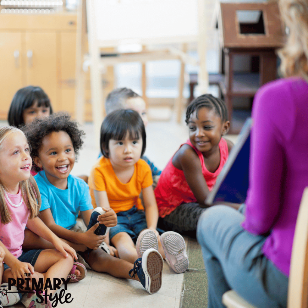 This photo shows a teacher sharing a book with her students. 