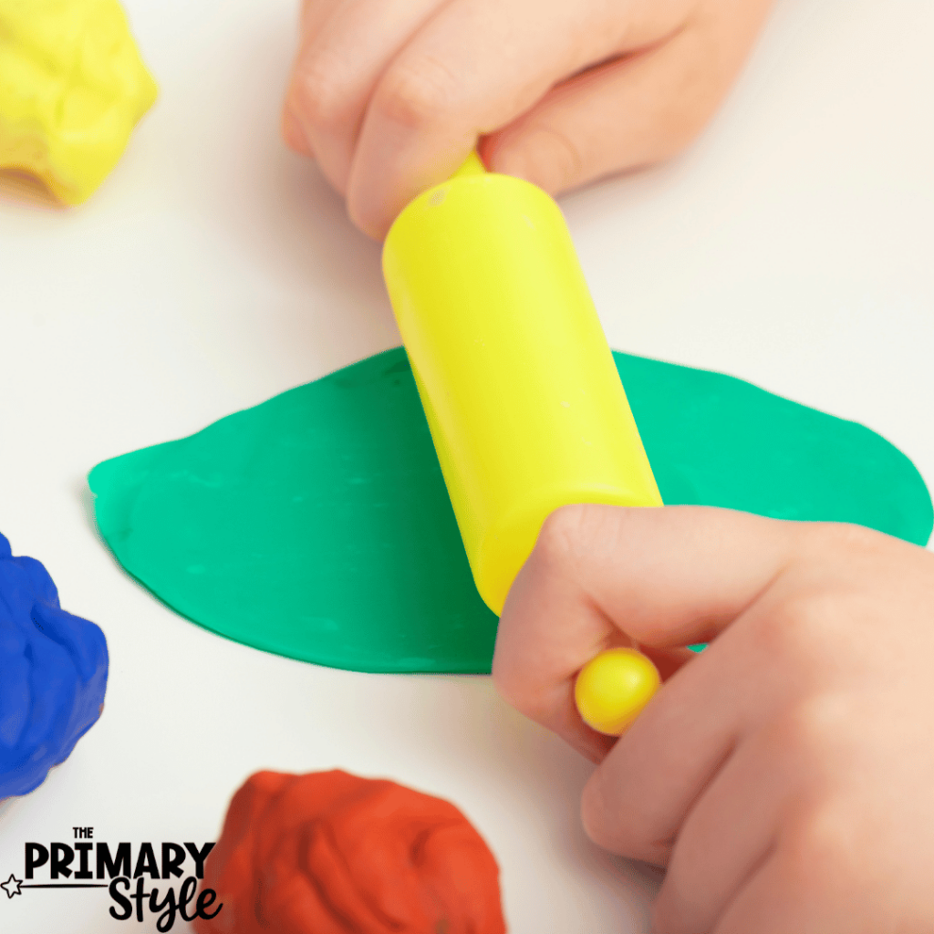 Using playdough, students can practice stamping letters.