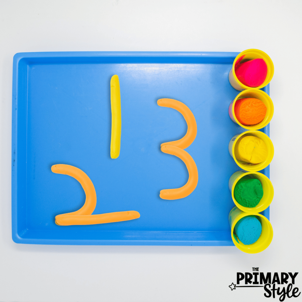 Students can practice number recognition by building numbers with playdough.